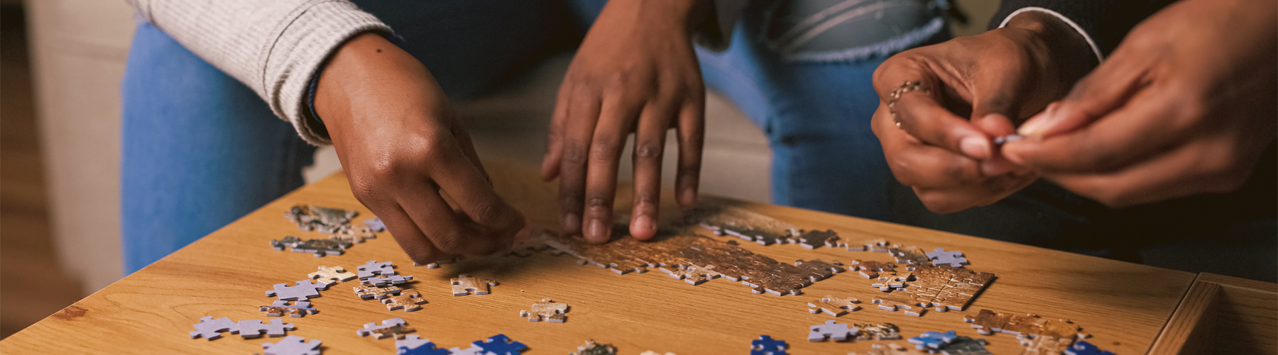 Couple putting together pieces of a puzzle