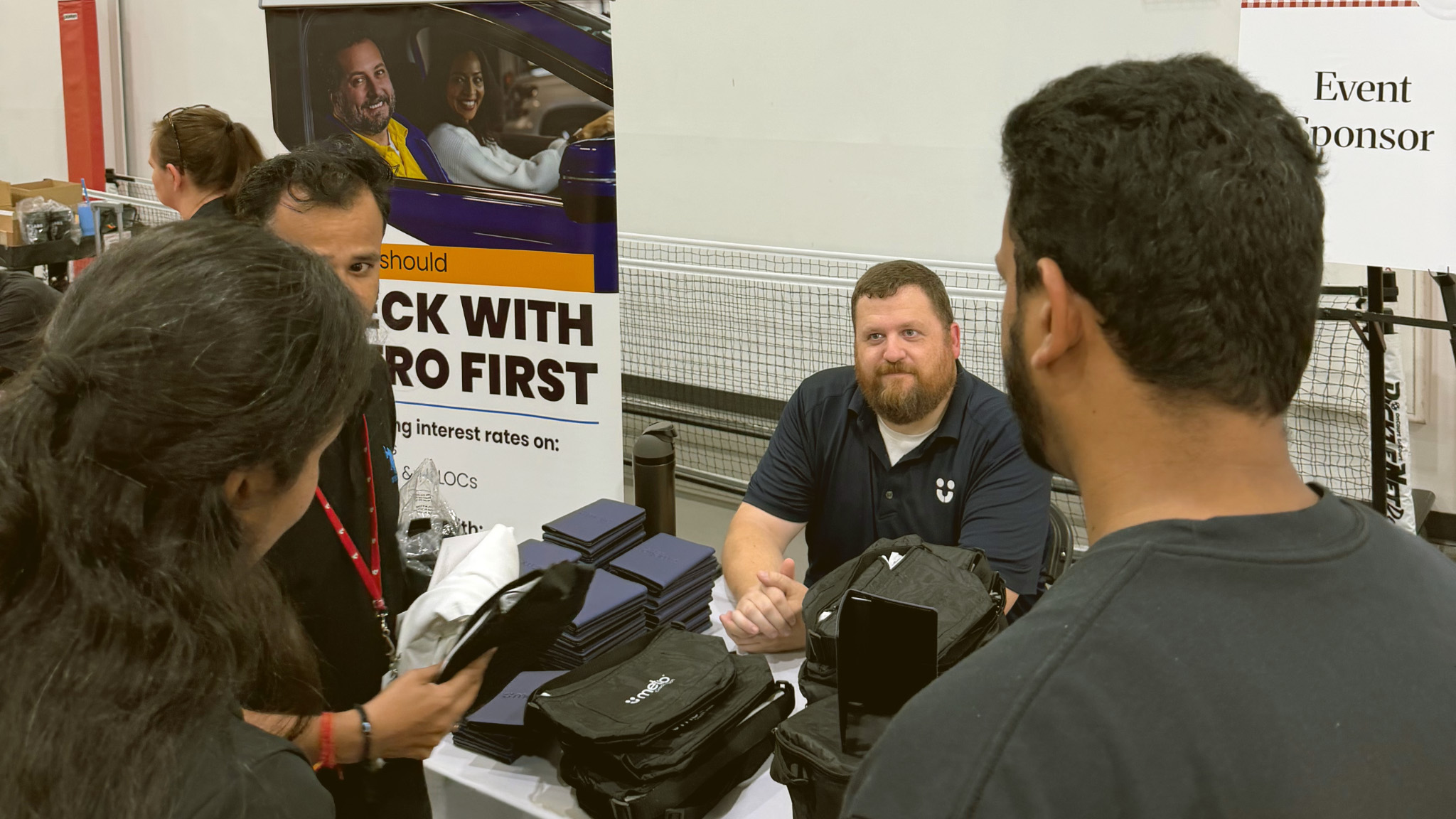 Metro employee handing out swag at UNMC BBQ event